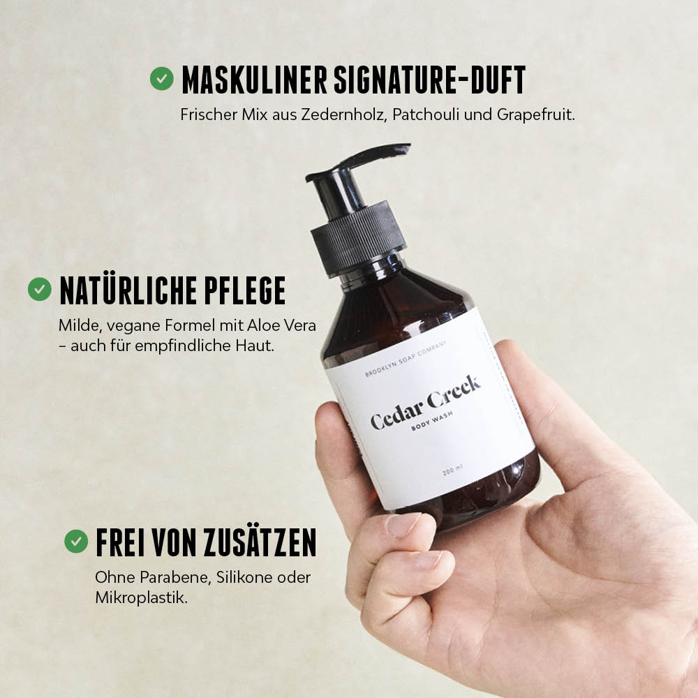 Cedar Creek Body Wash wird in der Hand gehalten, daneben Produktvorteile wie maskuliner Duft und vegane Formel.